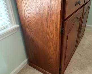 M12 - $75. Buffet / Server in Cedar Finish. C.J. Woodmaster. Very good condition. Measures 49.25" x 17.5" x 34" tall.