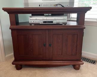 M13 - $30. TV / Media Stand in good condition. Measures 35.5" x 24.5" x 29.75" tall. Pressed wood. (We can't find anymore interior shelves for CD storage.)