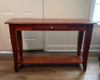 M27 - $35. Long Console / Sofa Table. Measures 48" long x 16" deep x 29.5" tall. Has single drawer. Has some marks on the top, scratches from use.