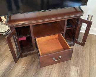 M3 - $35. TV / Media Cabinet. (Holding a 55" TV in this photo) Measures 43" wide x 25.5" deep x 25" tall.