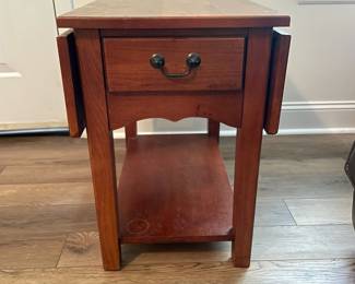 M28 - $20. Drop leaf side table. Measures 30" wide with leaves out. 15" wide when leaves are down. 25" deep x 25.25" tall. Sturdy! Great project piece. Does have wear on the top and water ring on the shelf.
