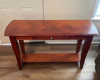 M27 - $35. Long Console / Sofa Table. Measures 48" long x 16" deep x 29.5" tall. Has single drawer. Has some marks on the top, scratches from use.