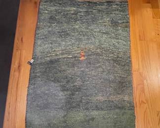 Handwoven Wool Rug with Abstract Design and Central Motif