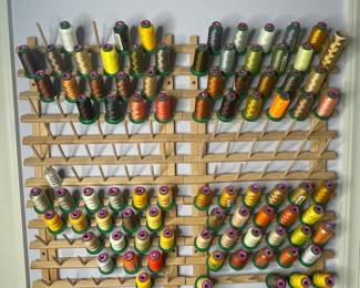 Embroidery Thread Spools on Wooden Rack