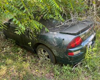 Several junked cars on the property. 