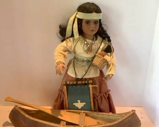 Native American Doll With Wooden Canoe