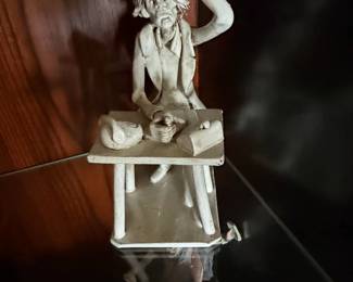 Humorous Figurine of a Man at a Desk