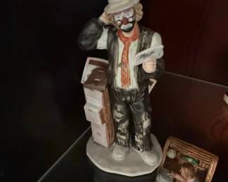 Figurine of a Clown Reading a Newspaper