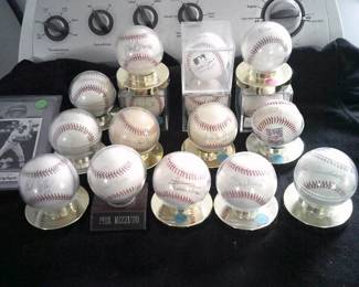 Autographed baseballs, many hall-of famers.