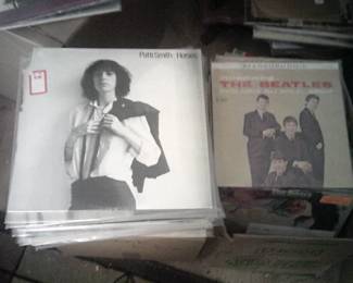 Over 1,000 vinyl L.P's originals featuring many rock classics like David Bowie, punk with Patti Smith , country Dolly Parton, and Jazz with Miles Davis.