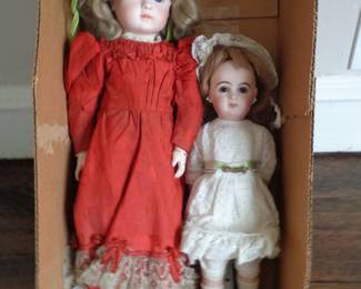 1870's era Steiner doll. Onleft in red dress.