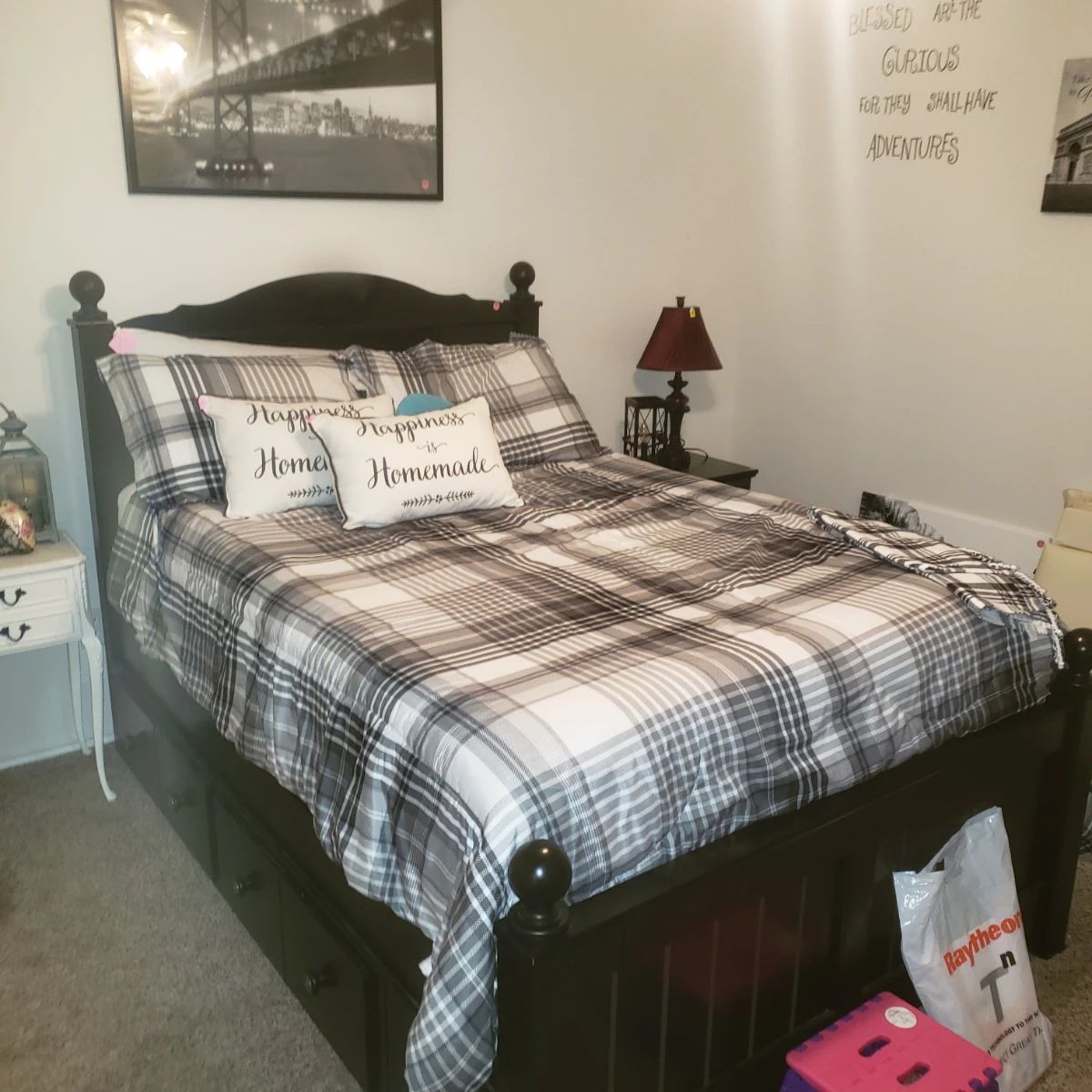 Full size bed with mattress and large storage drawers below plus matching nightstand