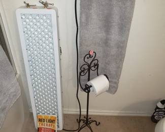 Red Light Therapy and book plus freestanding paper roll