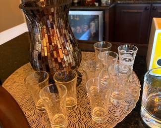 Shot glasses and vase