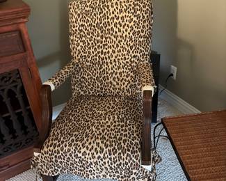 Leopard accent chair under nest is beige upholstered in great condition