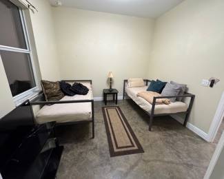 Two twin beds on metal frames