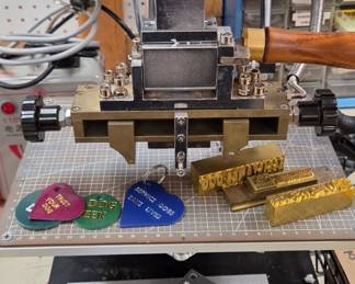 Huge hot stamp Branding machine for any kind of materials Close up showing Examples of Foil stamped leather And Branding plates ( Branding stamps Are not included In sale)