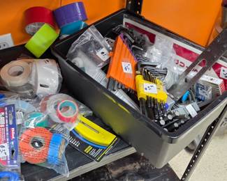 Lots of Alan wrenches various kinds of tape Labels And other tools