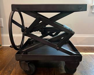 F25 - $1400. Restoration Hardware Industrial Scissor Lift Table. Measures 25.75" x 20" x 22" tall (adjustable height)