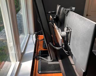 F54 - $100. Dual Monitor Workstation. Monitors NOT included. Adjusts from sitting to standing height.