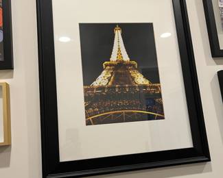 F65 - $10. Framed Eiffel Tower Print. Measures 19.25" x 23.25" tall.