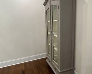 F26 - $250. Grey Display Cabinet with wooden shelves. Measures 38" wide x 15.25" deep x 79" tall.