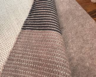 F37 - $450. Large Colca Wool Rug from West Elm. Overall very good condition - does have a few cut threads, spots of wear, in a couple places, see photos!