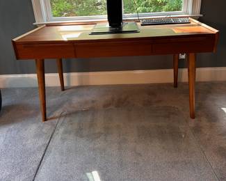 F55 - $650. Crate & Barrel "Tate" Desk. Measures 5' long x 30" deep x 30" tall. Solid Walnut & Walnut Veneer. Integrated Power Strip with 2 USBs and 2 - 3 prong outlets. Still on website. Excellent condition!