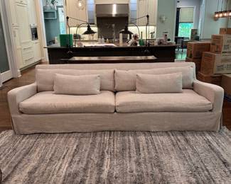 F5 - $2600. Restoration Hardware Belgian Slope Arm, 2 cushion Sofa. . Down filled cushions. Linen slipcover. Measures 9' long x 42" deep x 31" tall.