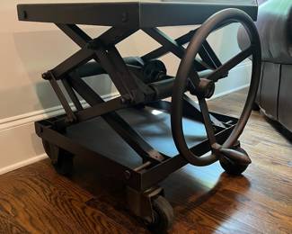 F25 - $1400. Restoration Hardware Industrial Scissor Lift Table. Measures 25.75" x 20" x 22" tall (adjustable height)