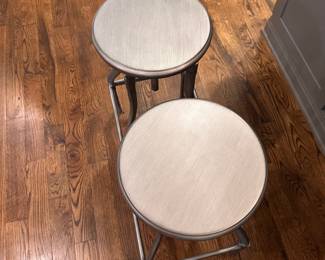 F44 - $175 PAIR. Crate & Barrel Turner Gunmetal Adjustable Backless Counter Stools. Seats are 13" round. Adjusts from 24-30" tall. Includes seat covers for both.