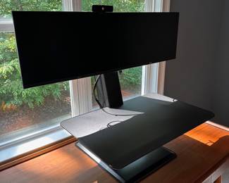 F54 - $100. Dual Monitor Workstation. Monitors NOT included. Adjusts from sitting to standing height.