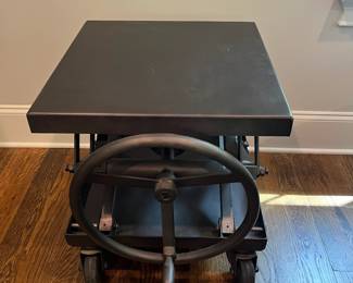 F25 - $1400. Restoration Hardware Industrial Scissor Lift Table. Measures 25.75" x 20" x 22" tall (adjustable height)