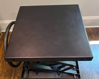 F25 - $1400. Restoration Hardware Industrial Scissor Lift Table. Measures 25.75" x 20" x 22" tall (adjustable height)