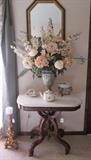 Eastlake parlor table with marble top & beautiful flower arrangement