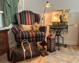 Striped Wingback Chair, Mission Style Floor Lamp, Accent Table, Lantern, Faux Louis Vuitton Duffle, Area Rug