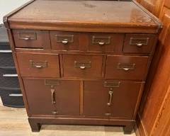 Vintage wood library card catalog or filing cabinet.