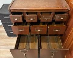 Vintage wood library card catalog or filing cabinet.