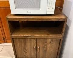Microwave and cabinet.