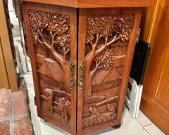 Vintage hand carved teak wood corner bar Asian landscapes.