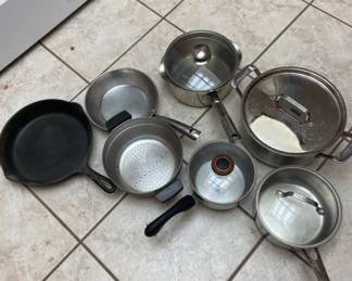 Assorted Pots And Pans With Cast Iron Skillet.