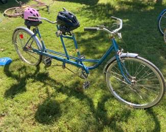 Tandem Bike And Two Helmets