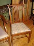 ONE OF THE DINING CHAIRS 