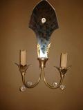 CLOSE UP OF ONE OF TWO WALL SCONCES