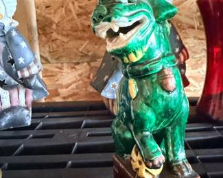 Green ceramic dog figurine