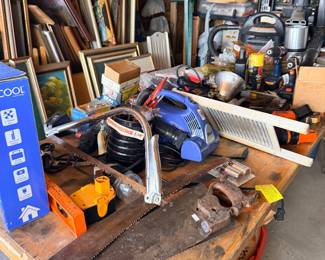 Tool table with saws and garage gear