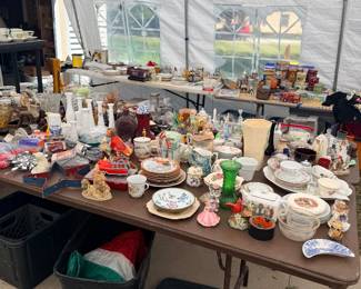 Table full of dishes, glassware, and decor