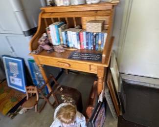 Roll top desk, books, Collector “Jerry” doll, printed frames, antique dolls