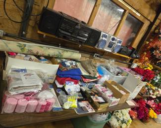 fabric, rug making supplies, faux flowers, stereos