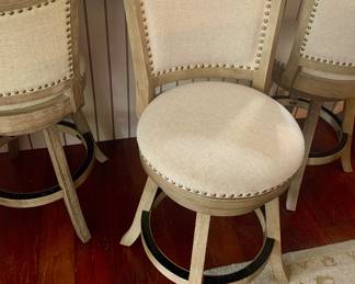 six matching swivel barstools